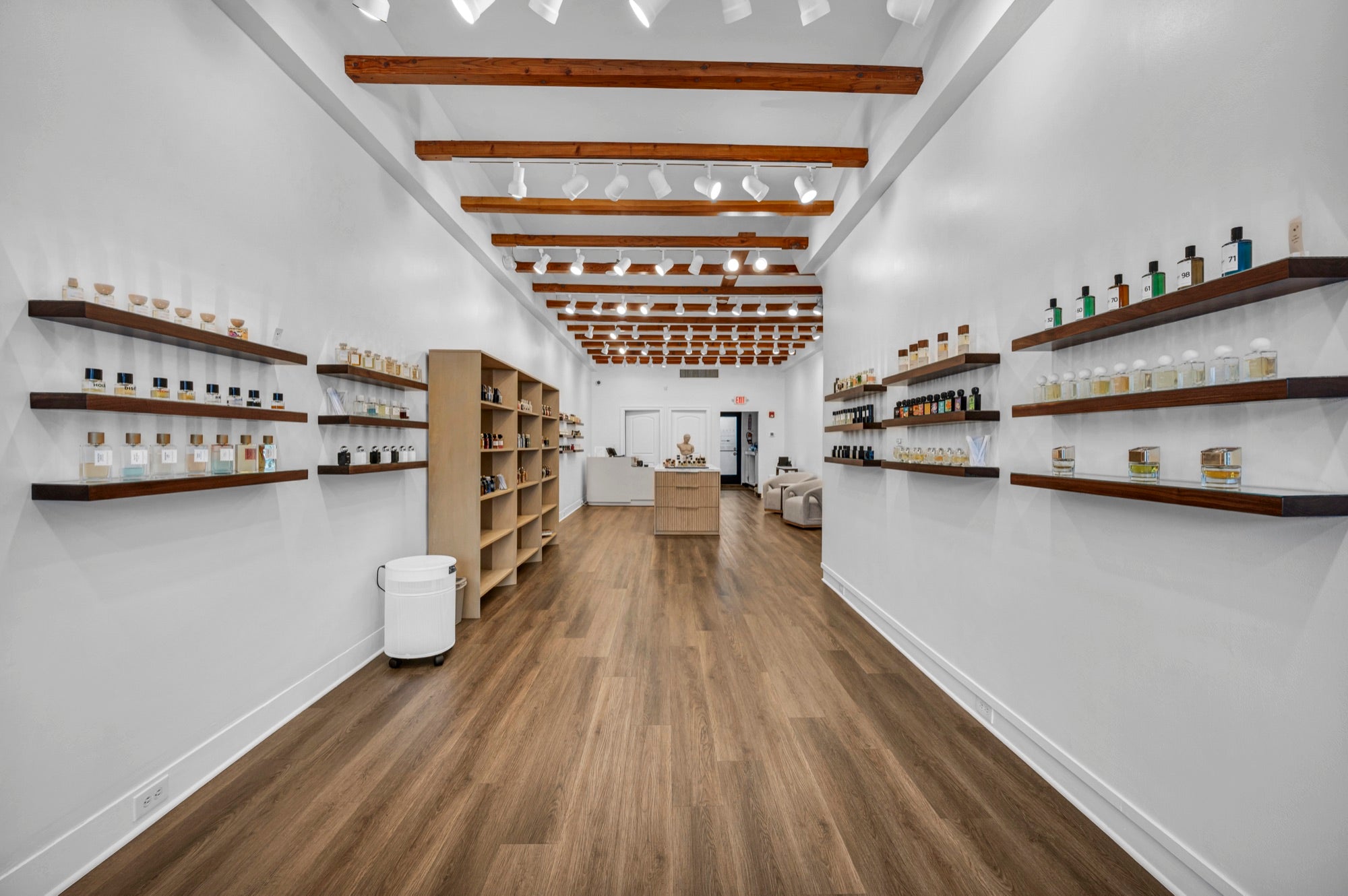 Floor-to-ceiling niche fragrance shelves at Xtrait Perfumery
